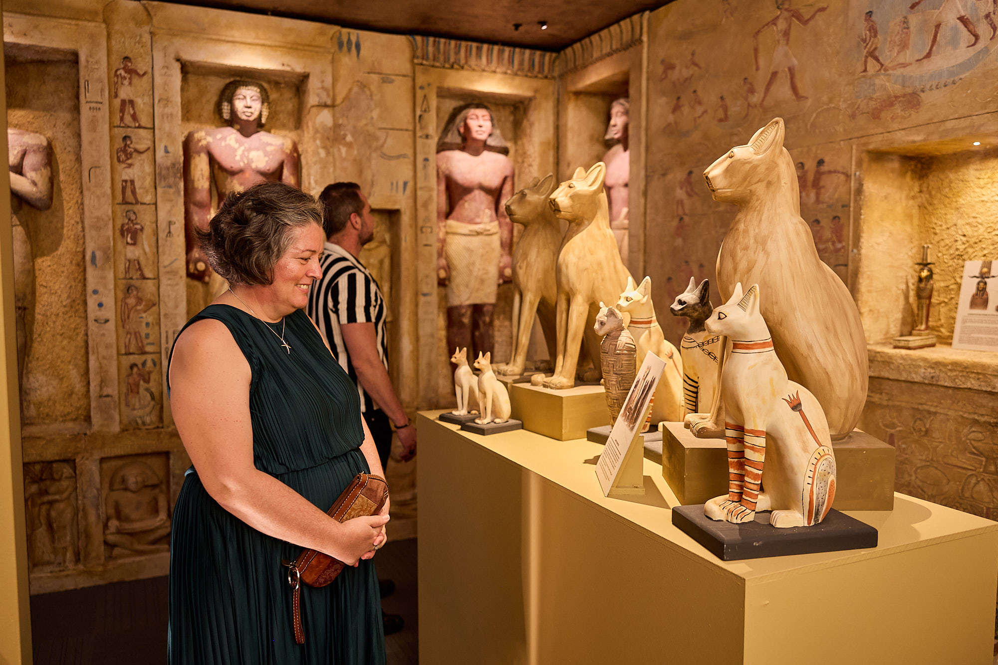 a man and a woman standing in front of a box